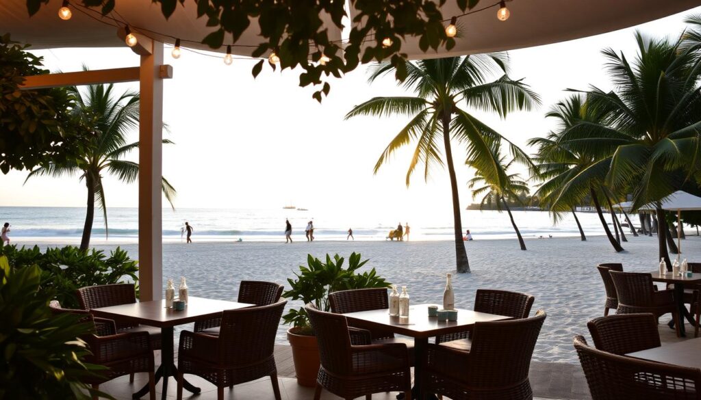 A serene beachfront setting at FOC Sentosa, Singapore. In the foreground, a chic open-air dining area with elegant wicker furniture and lush tropical foliage, bathed in the warm glow of string lights. The middle ground showcases the pristine white sands and azure waters of Sentosa beach, with a few beachgoers strolling along the shore. In the background, the silhouettes of palm trees sway gently in the breeze, creating a tranquil and inviting atmosphere. The scene is illuminated by a soft, golden sunset, casting a dreamy, romantic ambiance over the entire setting.