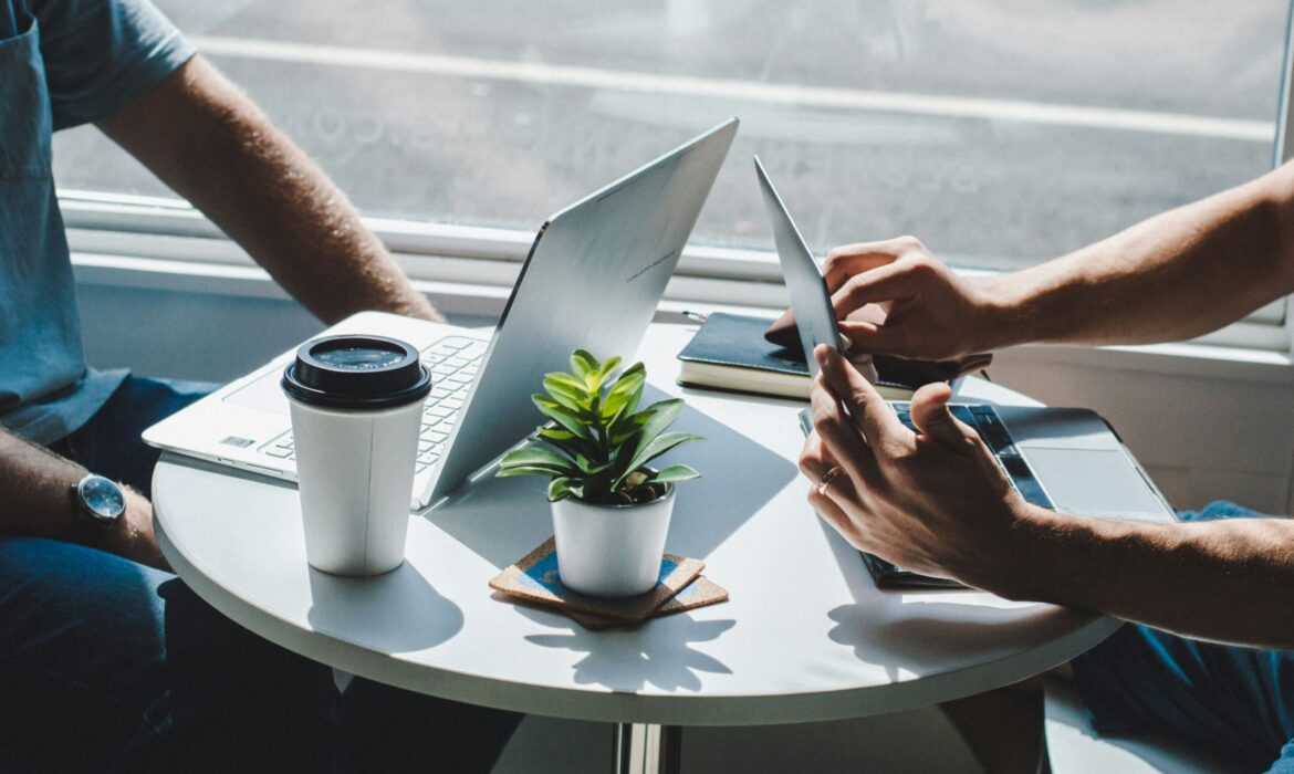 Laptops meeting in coffee shop