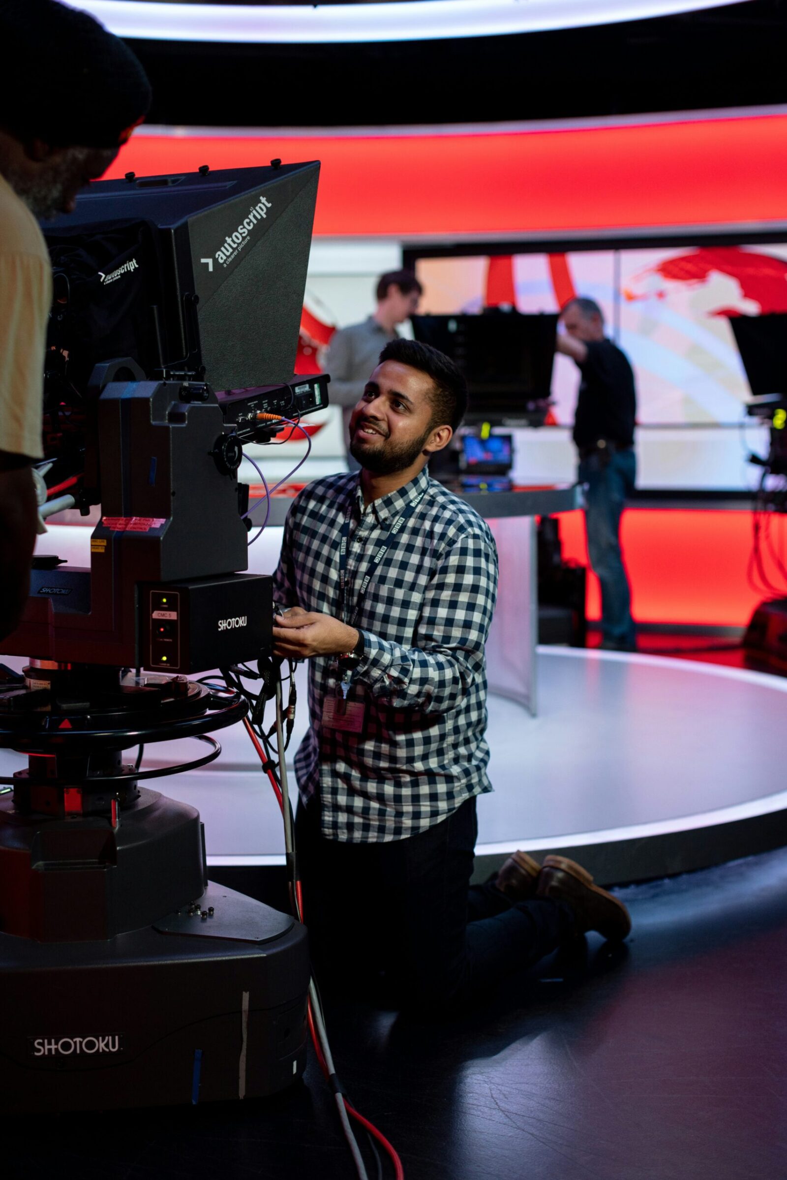 Male broadcast engineer works in studio